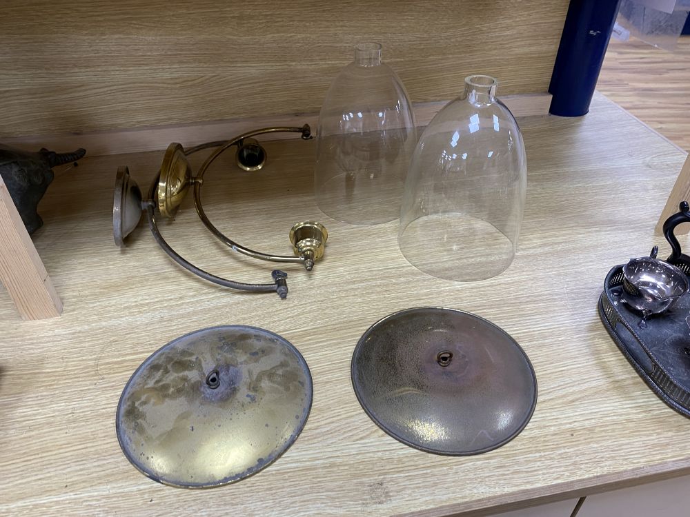 A pair of glass and brass hurricane lamps